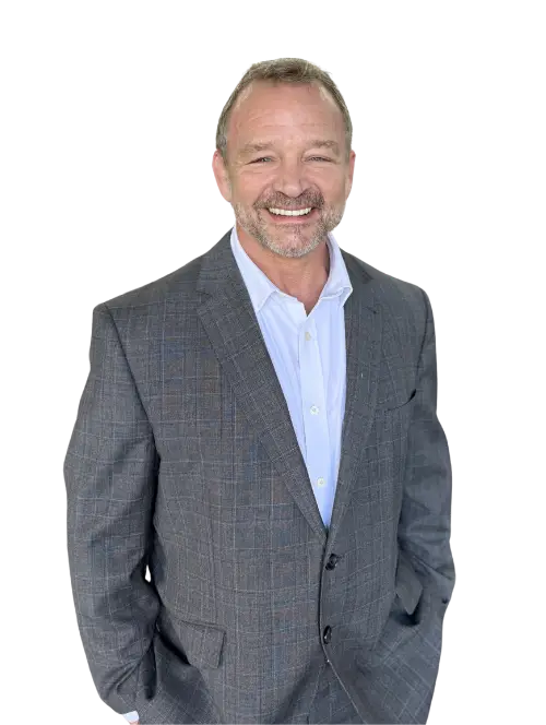Joe Butler, Founder and CEO of Butler Wellness Group, standing in a fitness training facility.